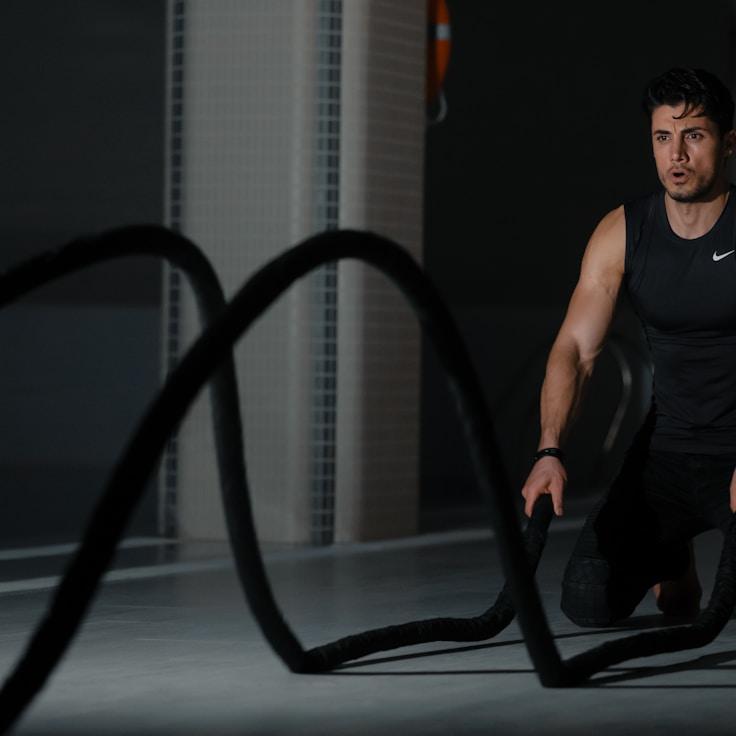 Interior of a professional gym with weight training equipment and mirrors